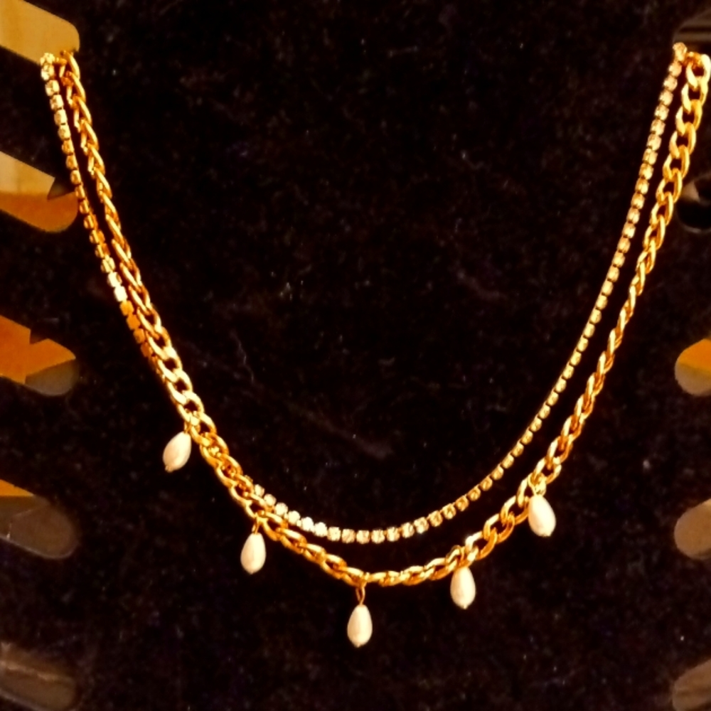 Double chain necklace with tear drop pearl accents and rhinestones.